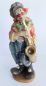 Preview: Detailliert geschnitzte Holzfigur Clown mit Saxophon farbig gefasst 19cm